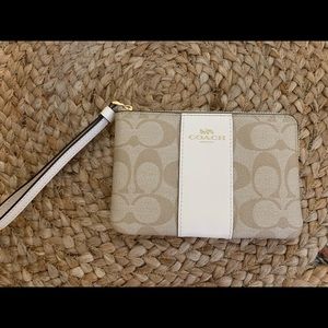 Authentic Coach tan and white wristlet!